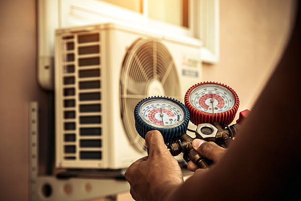 Professional Air Conditioning Service technician working in Toney, AL
